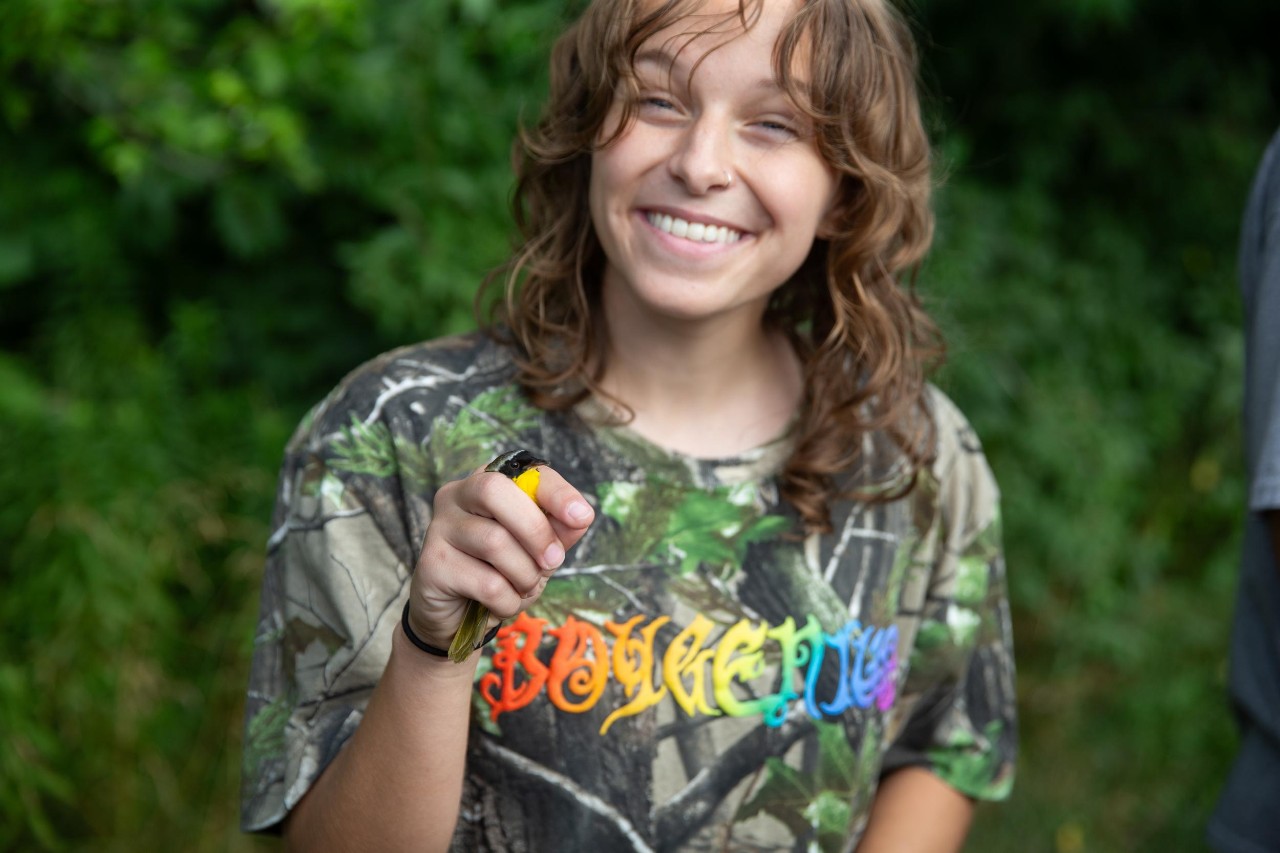UC biologist and ornithologist Ron Canterbury at the Center for Field Studies with helpers banding birds for research.