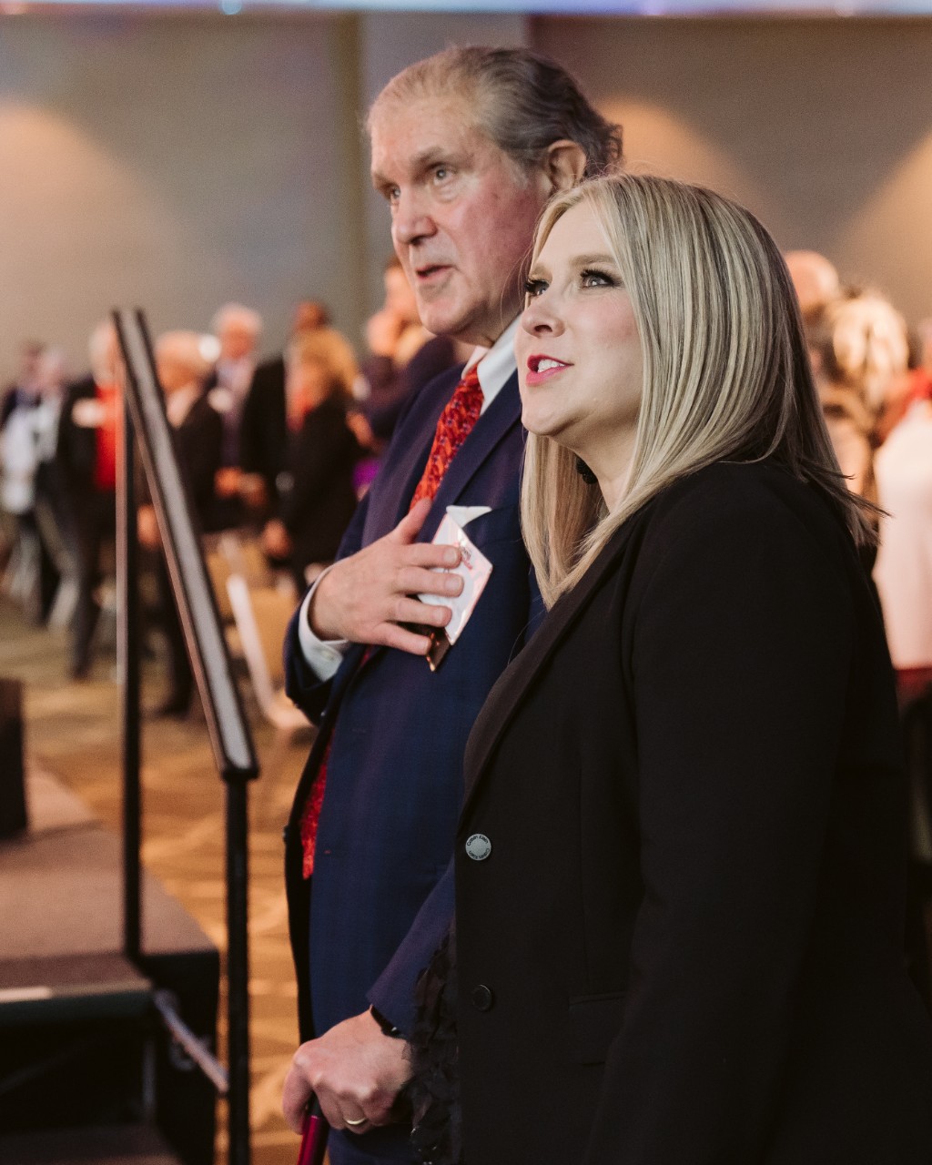 Dr. Kereiakes singing the “Alma Mater” with UC Chief Alumni Officer Jennifer Heisey