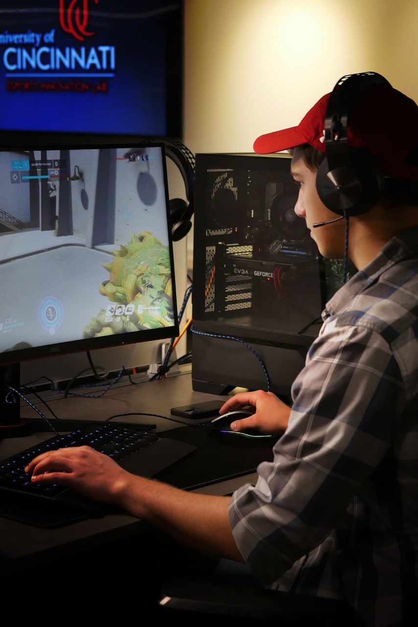 A UC student plays a video game inside the Esports Innovation Lab. 