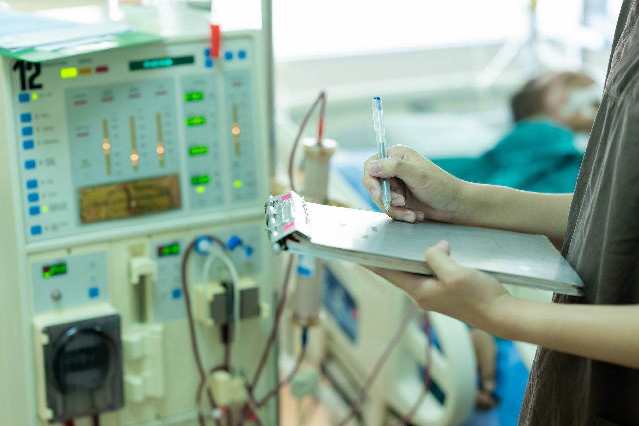 image of dialysis machine operated by medical official