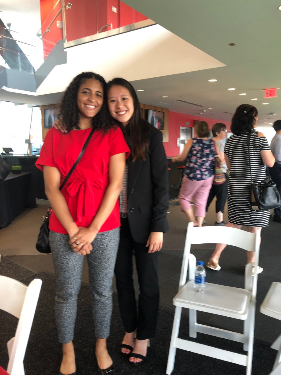 Tia Current poses with another Summer Bridge student in Nippert Stadium's west pavilion