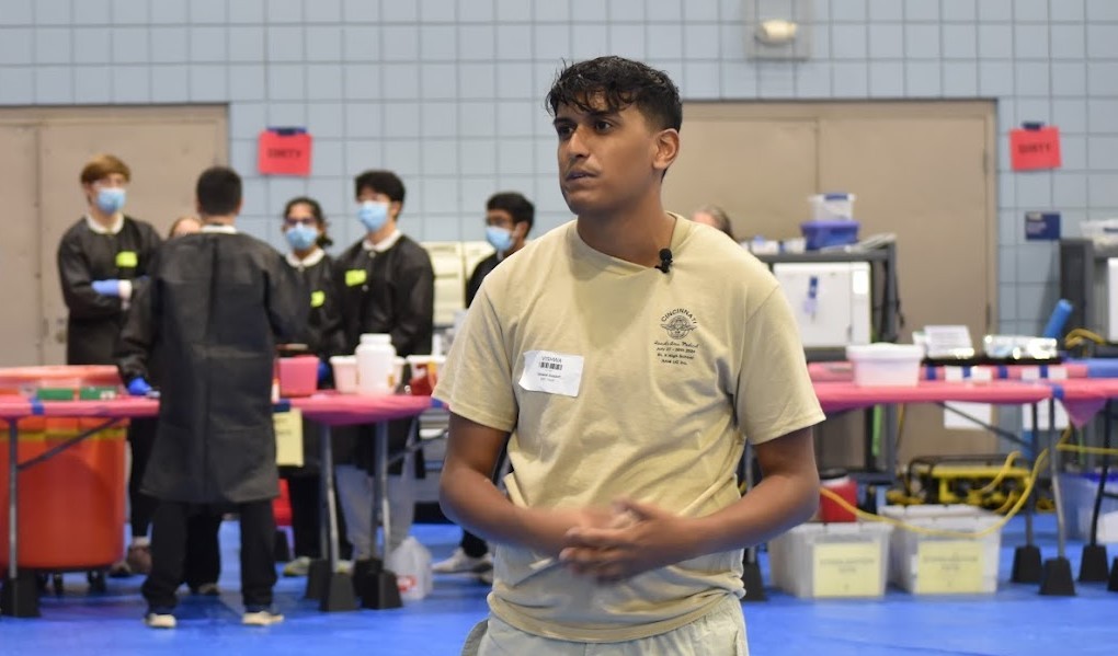man standing in gymnasium
