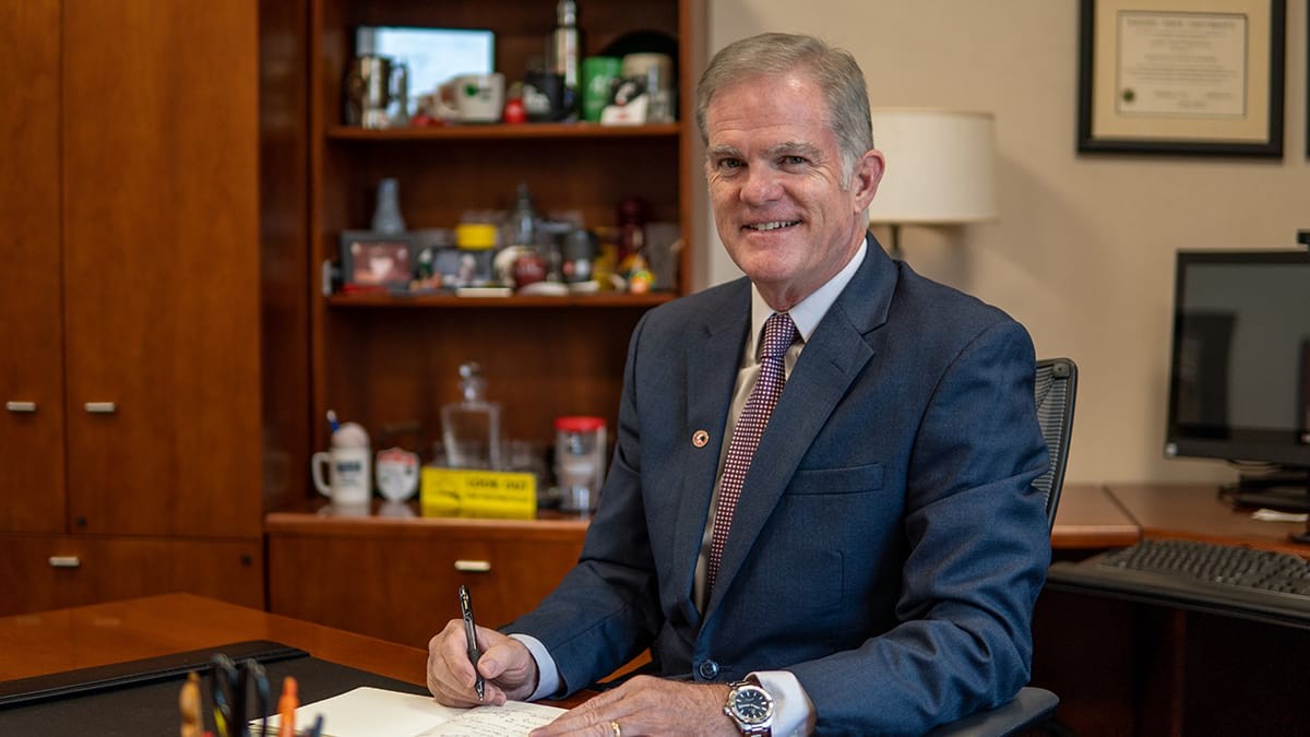 UC Clermont Dean Jeff Bauer seated at desk. 