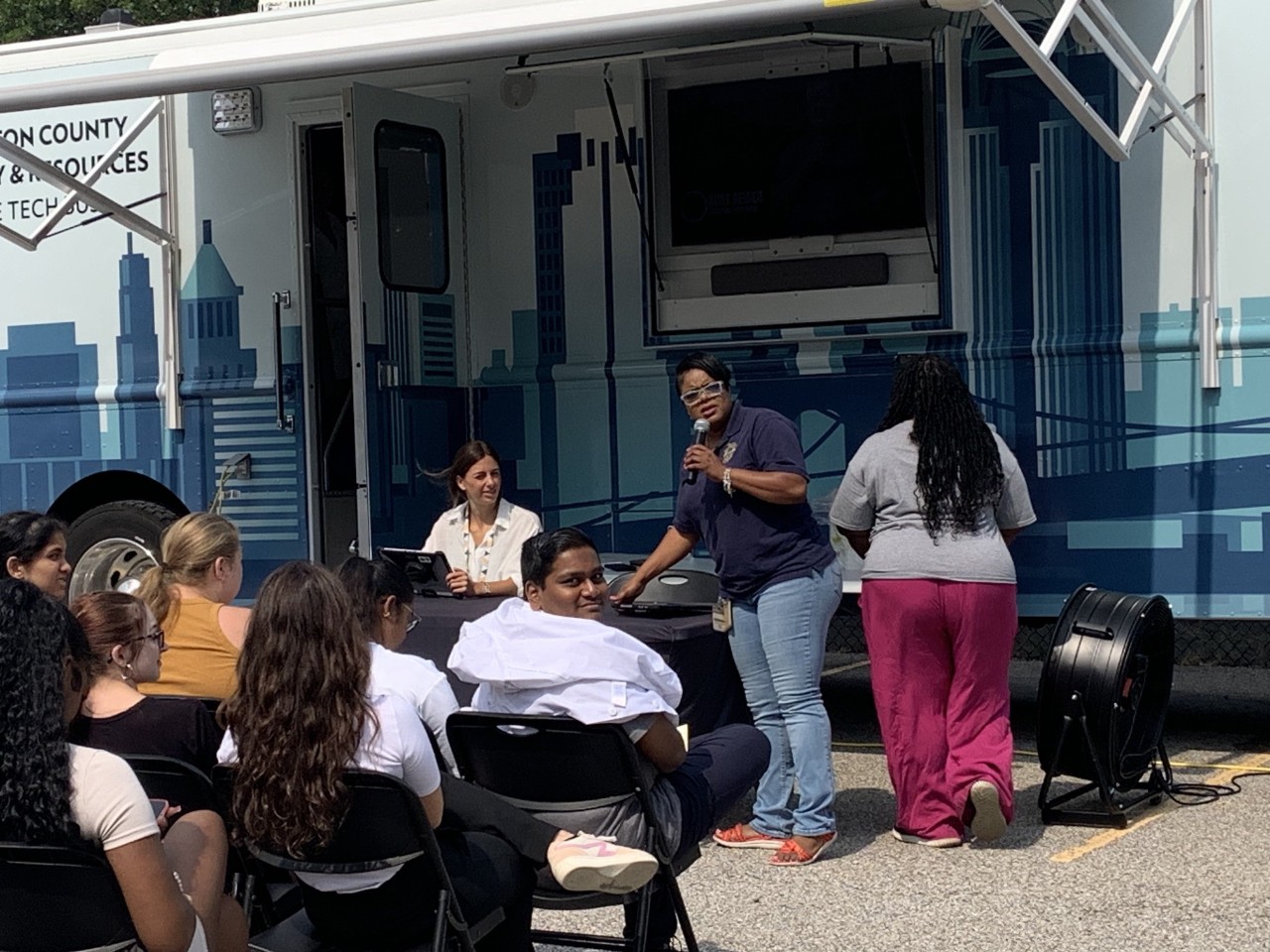 Travina Adams speaking at the 513Relief Bus event at UC's 1819 Innovation Hub.