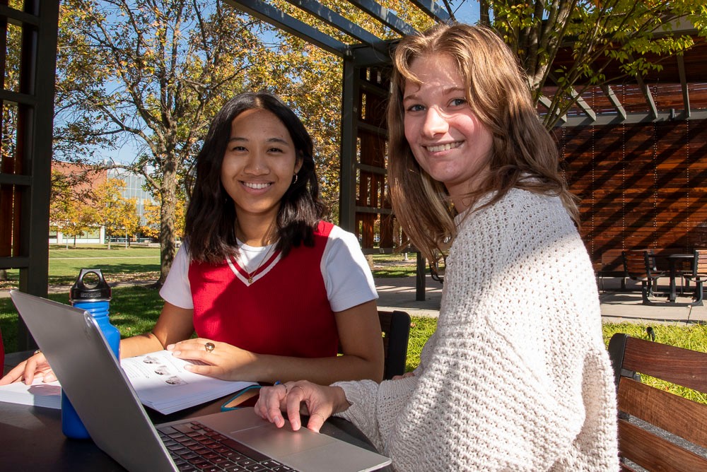 image showing two students studying on the UC Blue Ash campus