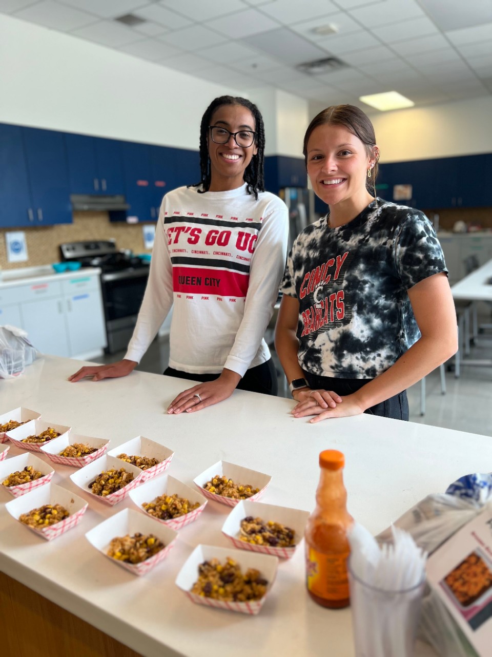 Meyer and Coley standing at a table