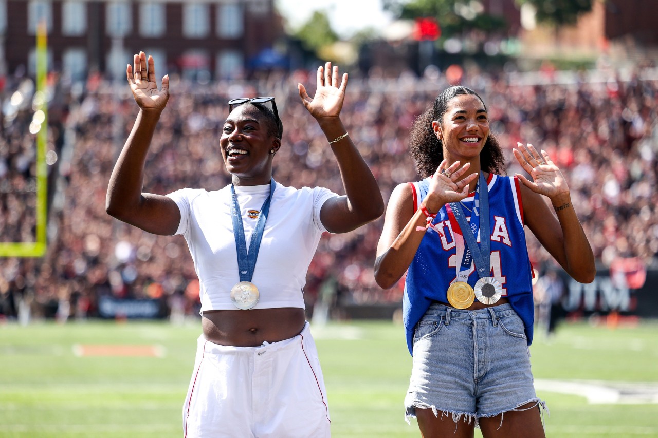 Univeristy of Cincinnati alumni Jordan Thompson, olympic gold and silver medalist, and Annette Echikunwoke, hammer throw silver medalist, are recognized during The University of Cincinnati Bearcats’ game against the Houston Cougars on Saturday, September 21, 2024 at Nippert Stadium in Cincinnati, OH. The Bearcats defeated the cougars 34-0.