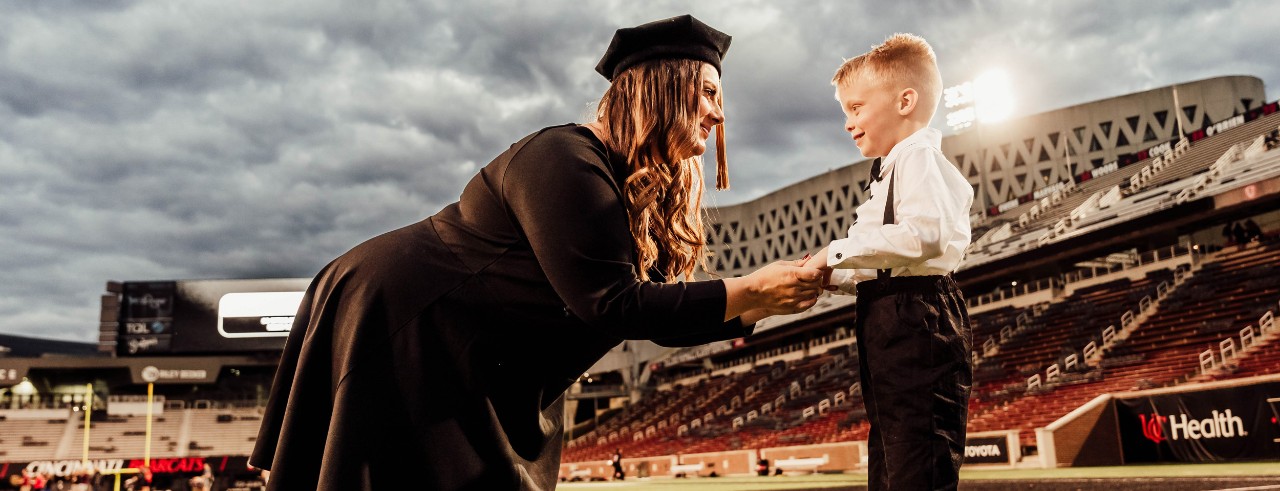 Misty Bauer and her son at Nippert Stadium