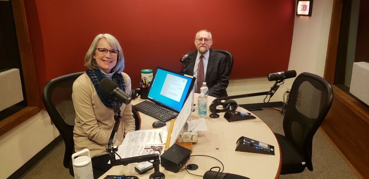 WVXU Journalist Lucy May is shown with Professor Paul Finkelman sitting in a radio studio