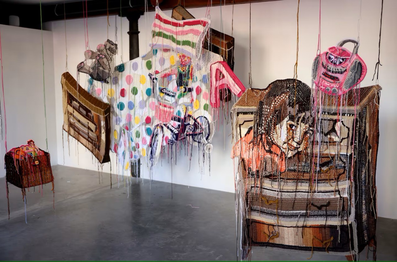 Baylee Schmitt's yarn art on display at Boston gallery.