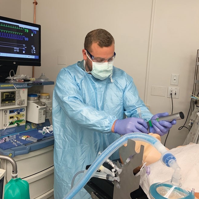 CRNA sttudent, practices intubation in the nurse anesthesia program's simulation lab. Photo/Charity Huber/UC College of Nursing