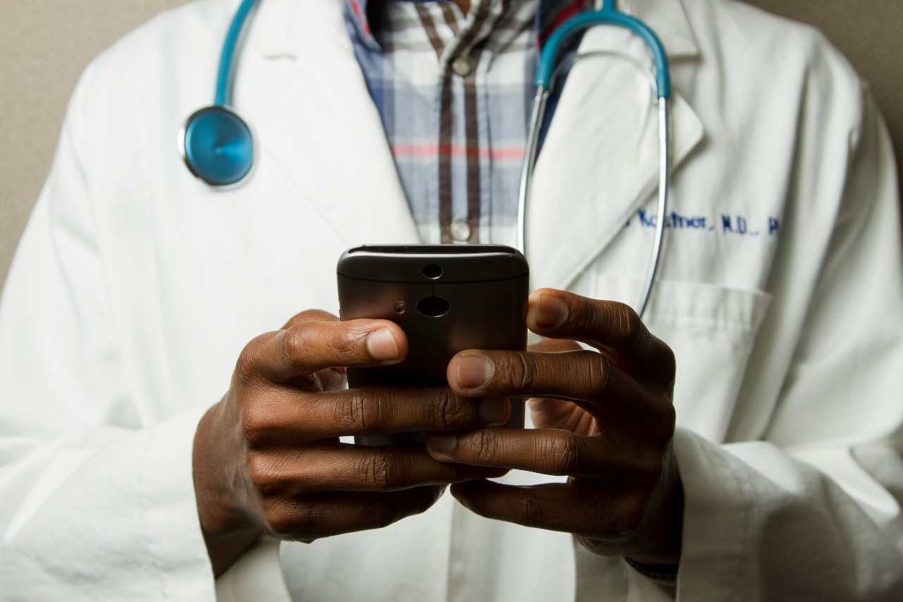 Doctor using cell phone