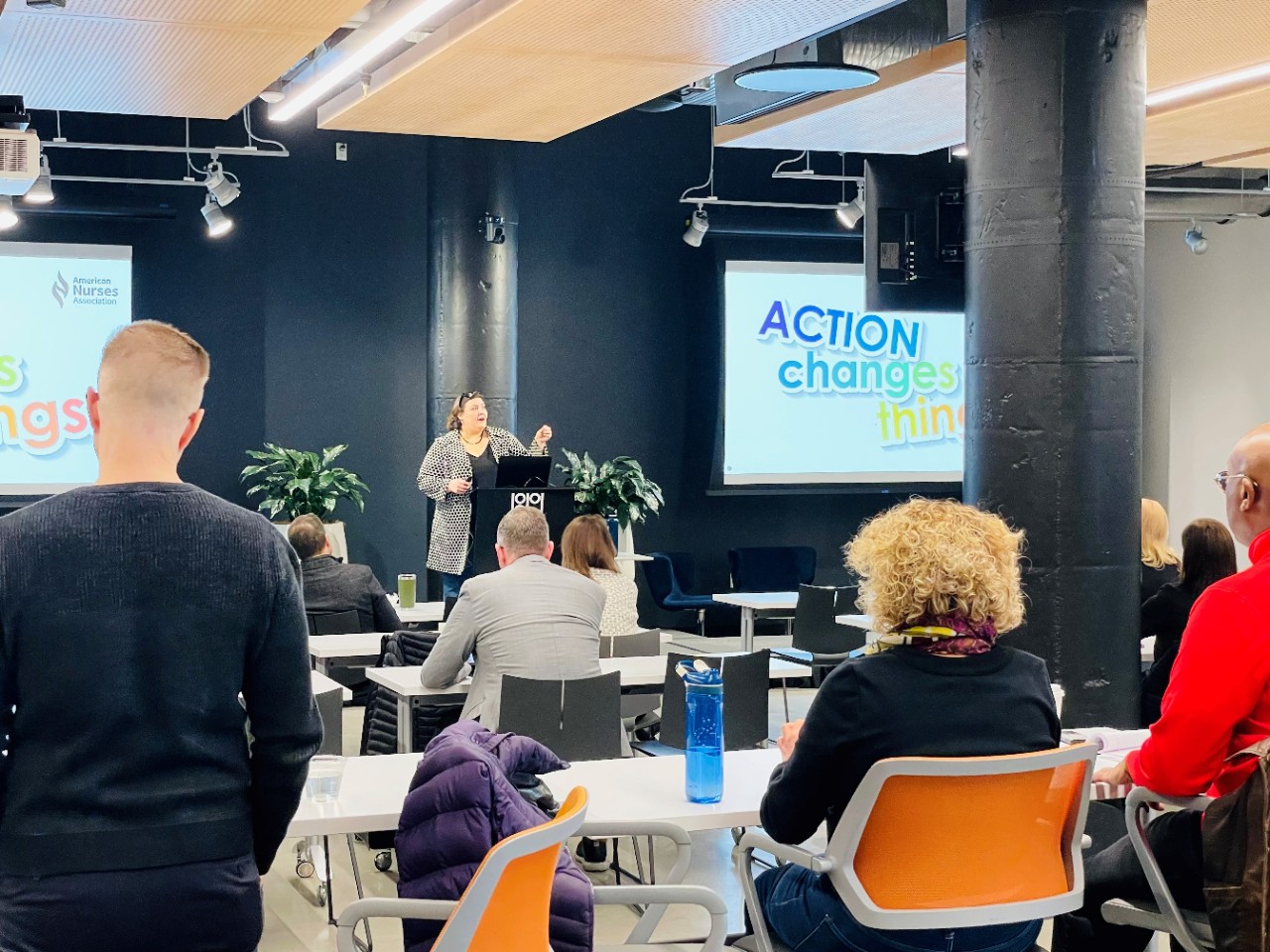 Participants and guest speaker gather in 1819 event space 