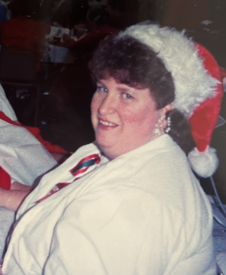 Karen Sanders wearing a Santa hat