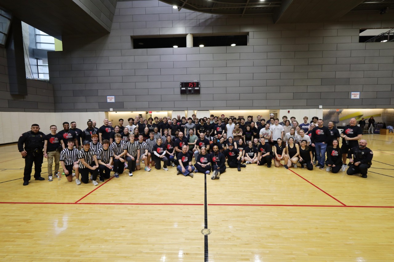A group photo of the participants and volunteers for the UCPD 3v3 Scholarship Basketball Tournament.
