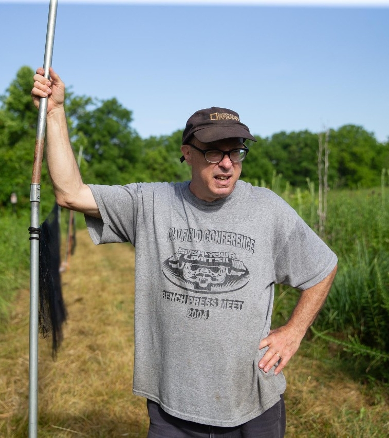UC biologist and ornithologist Ron Canterbury at the Center for Field Studies with helpers banding birds for research.