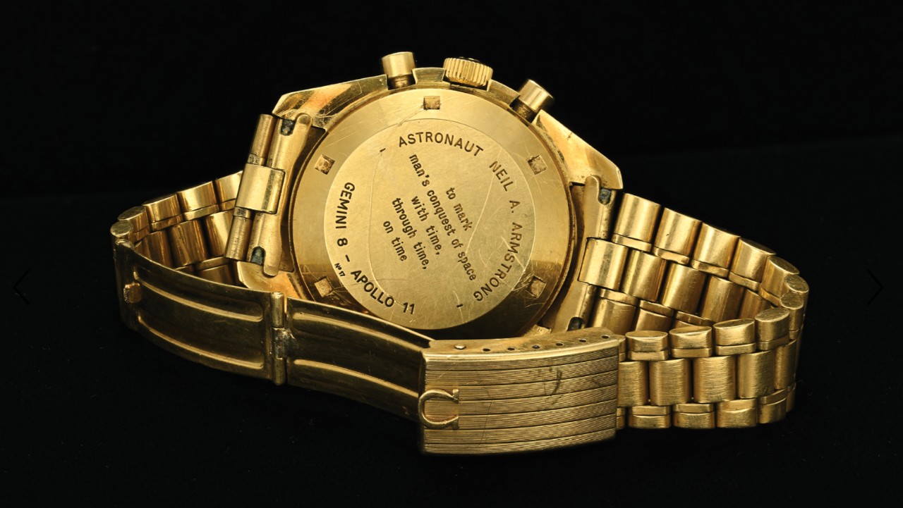 The back of an Omega watch features an inscription: Astronaut Neil A. Armstrong to mark man's conquest of space with time, through time, on time, Gemini 8 to Apollo 11.