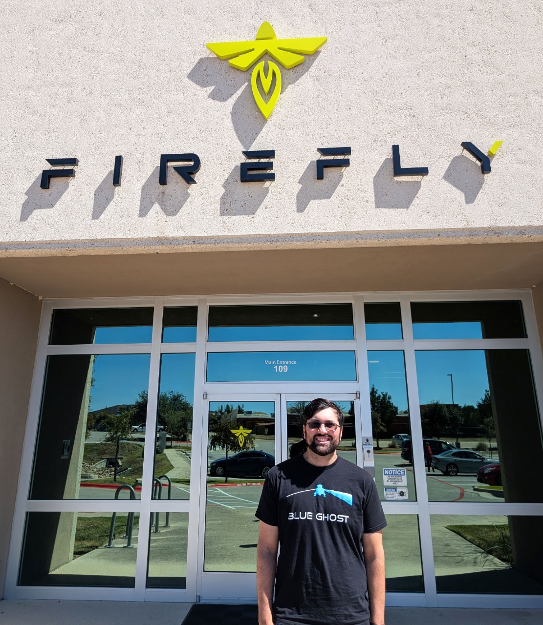 Ilyas Malik, UC Mechanical Engineering student in front of Firefly Aerospace