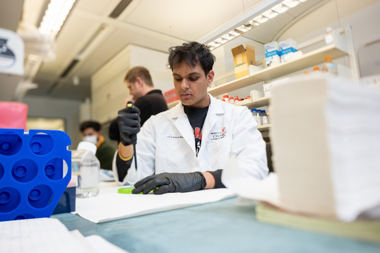 Jay Patel, a sophomore in the Medical Sciences program, works as a researcher in Dr. Cunningham's cancer research lab.