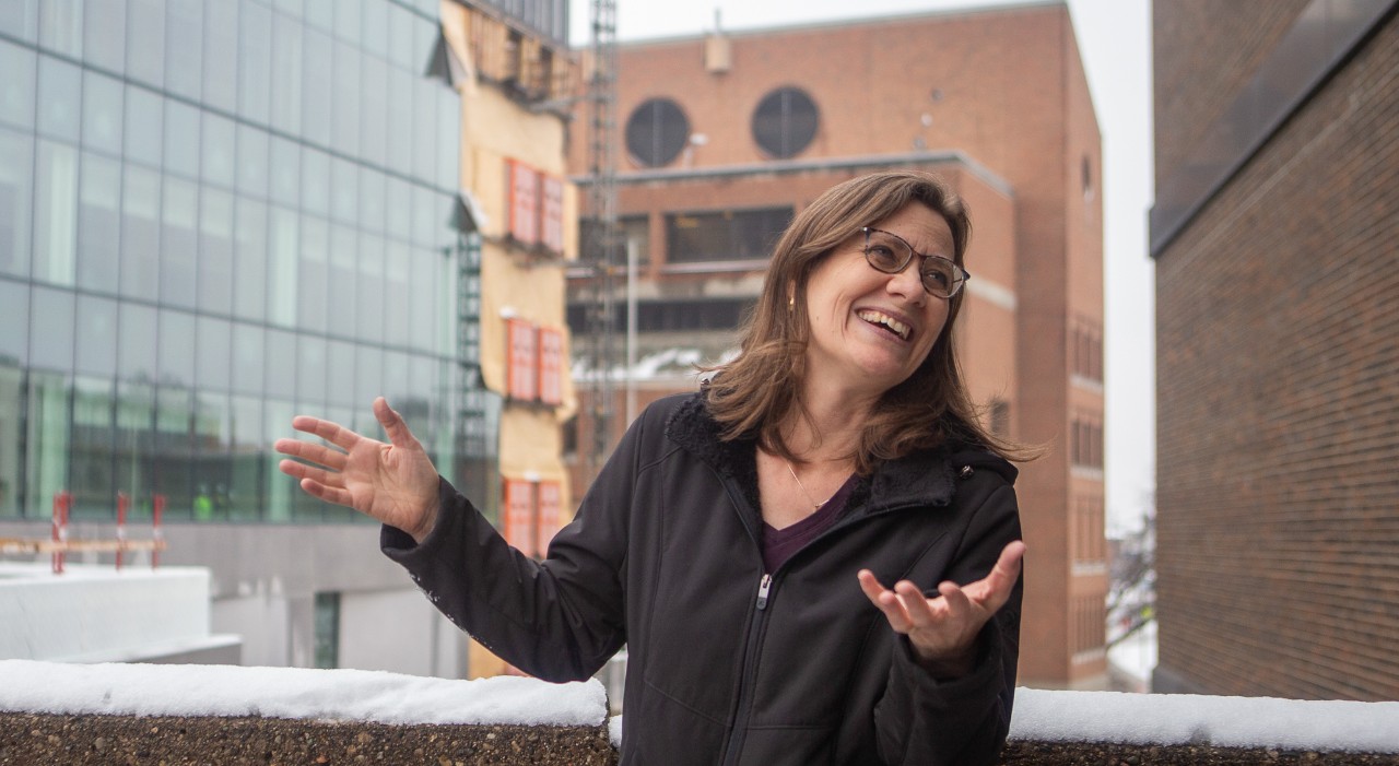 Theresa Culley gestures while talking in front of Old Chem.