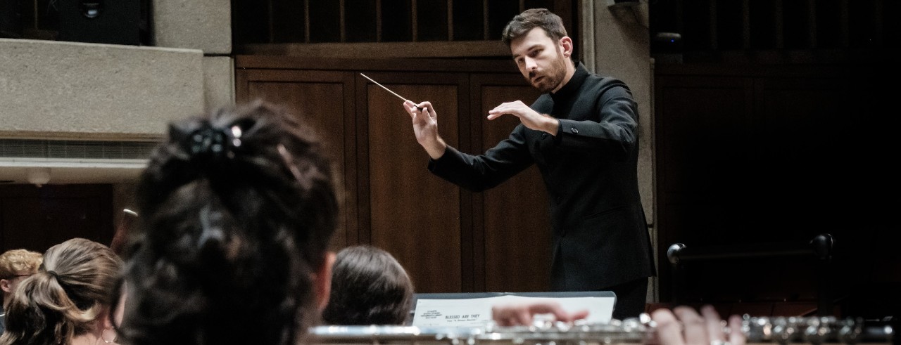Tyler Ehrlich conducts the University of Texas Symphony Band. Photo/Nathan Russell