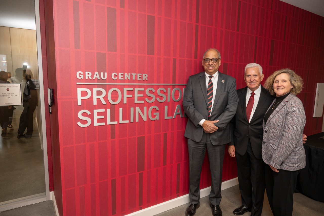 Dr. Neville G. Pinto, president of University of Cincinnati, Marianne Lewis, Dean of University of Cincinnati Lindner College of Business shown here with students, faculty as they enjoyed Jim Grau’s Grau Center Professional Selling Lab ribbon cutting ceremony Wednesday March 5, 2025 at the Lindner College. Photos by Joseph Fuqua II 