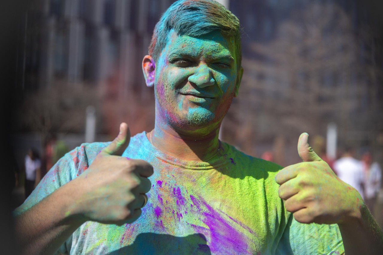 Students celebrate Holi festival of colors.