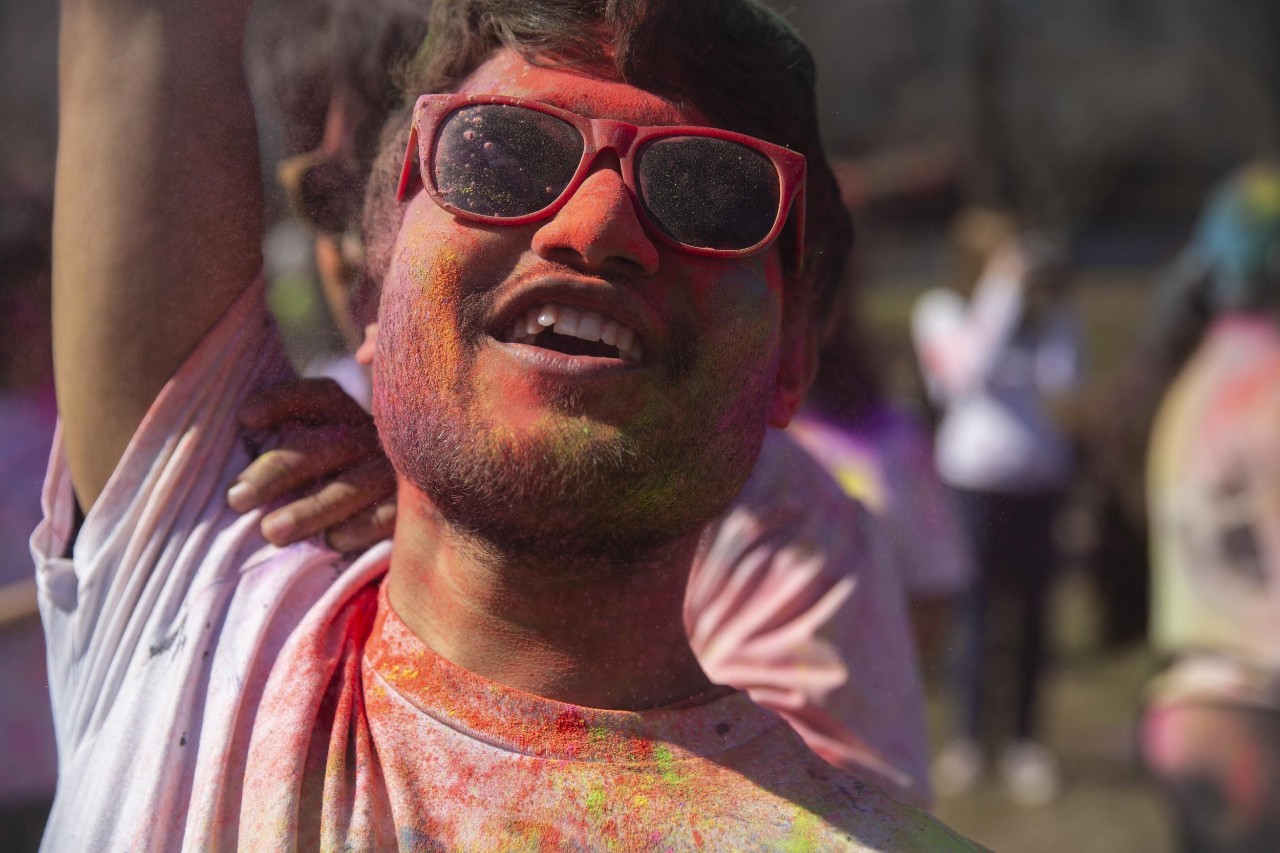 Students celebrate Holi festival of colors.