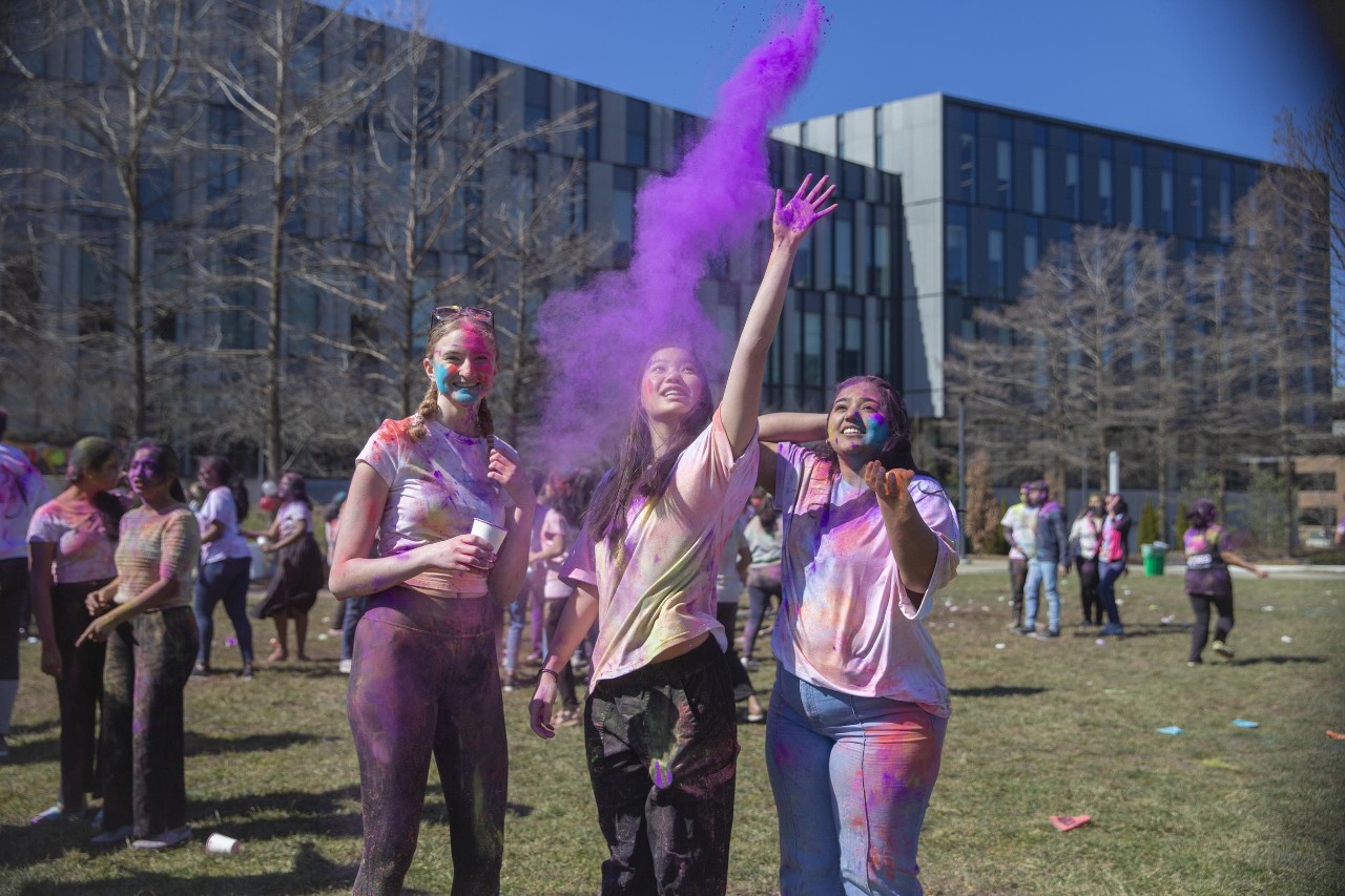 Students celebrate Holi festival of colors.