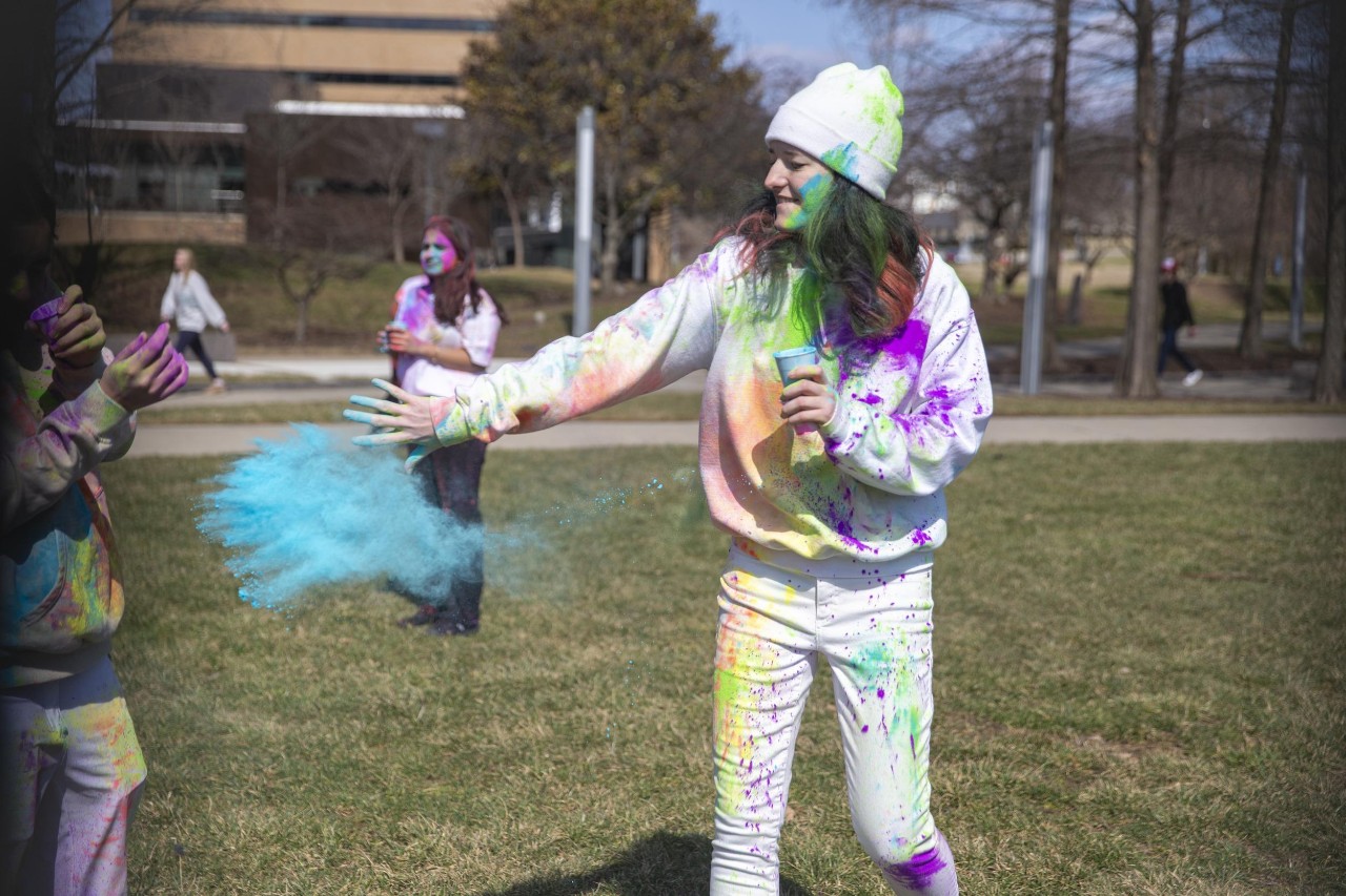 Students celebrate Holi festival of colors.