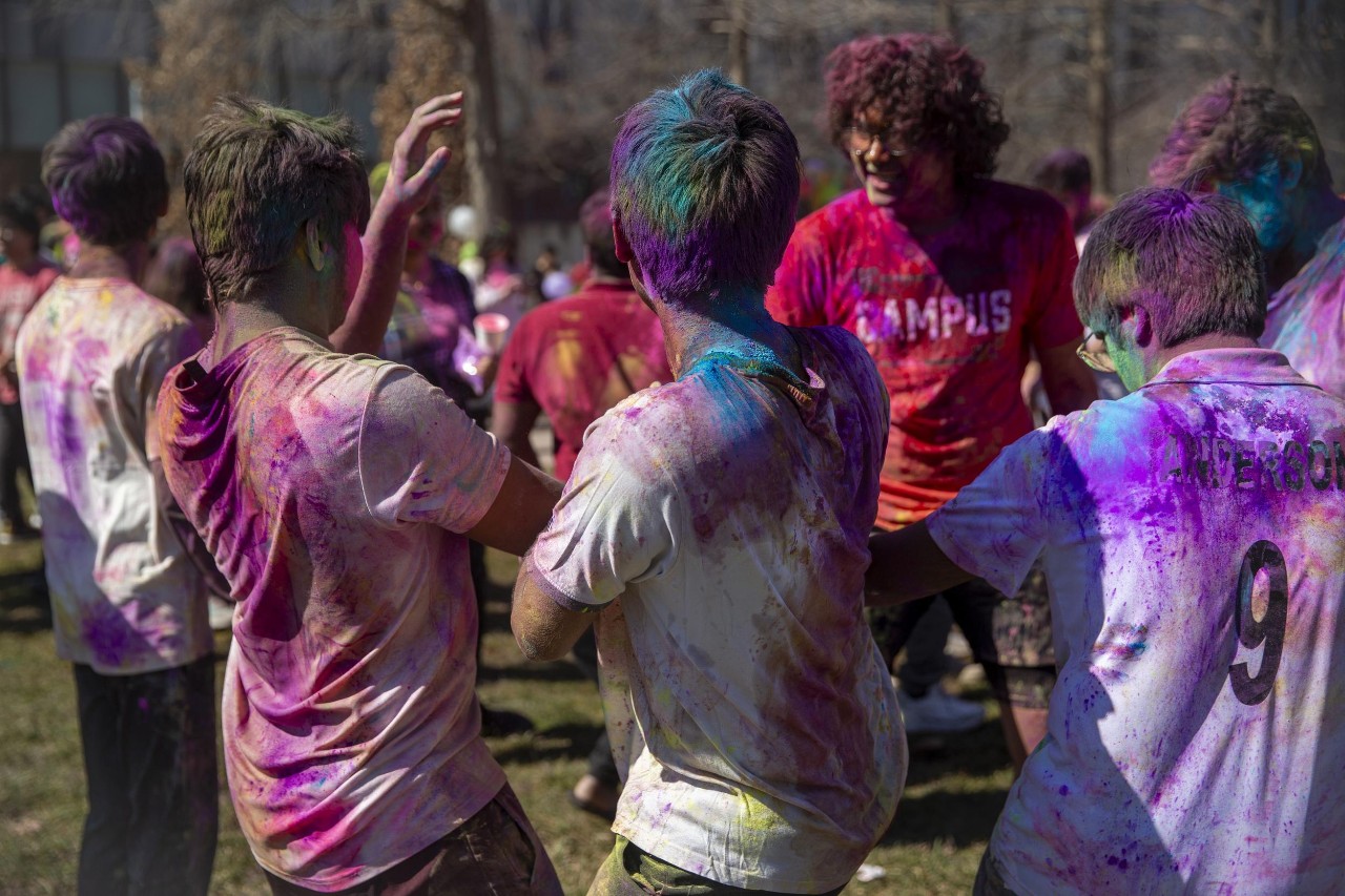 Students celebrate Holi festival of colors.