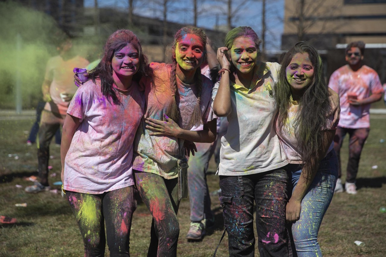 Students celebrate Holi festival of colors.
