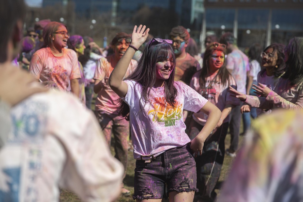 Students celebrate Holi festival of colors.