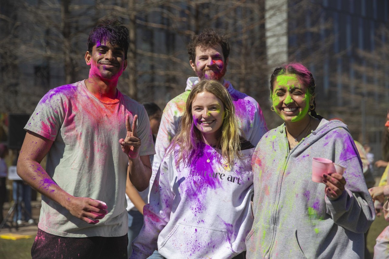 Students celebrate Holi festival of colors.