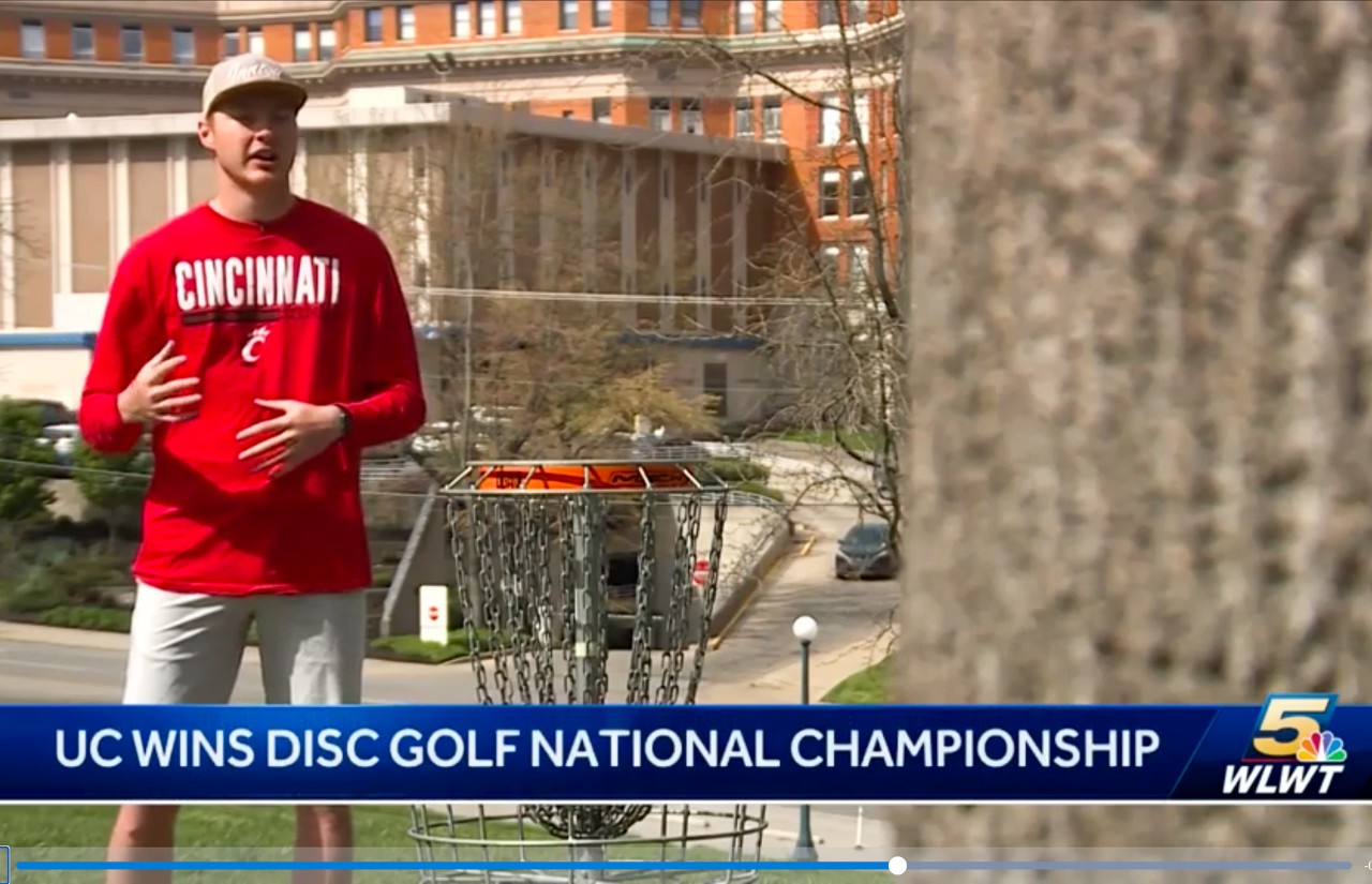 Lucas Foglesong talks to WLWT in front of a disc golf basket.