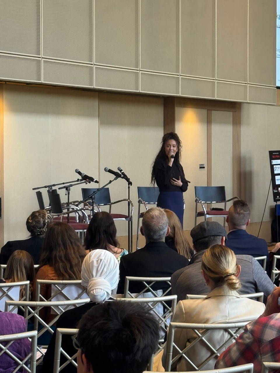 a singer presents on a stage