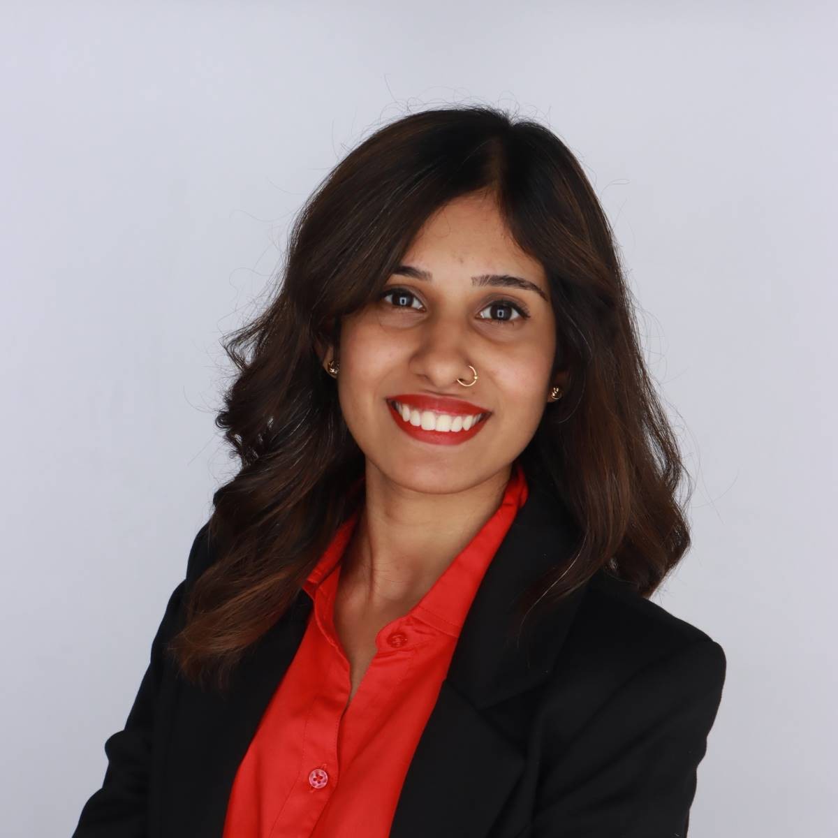 portrait of a woman in red blouse and black jacket