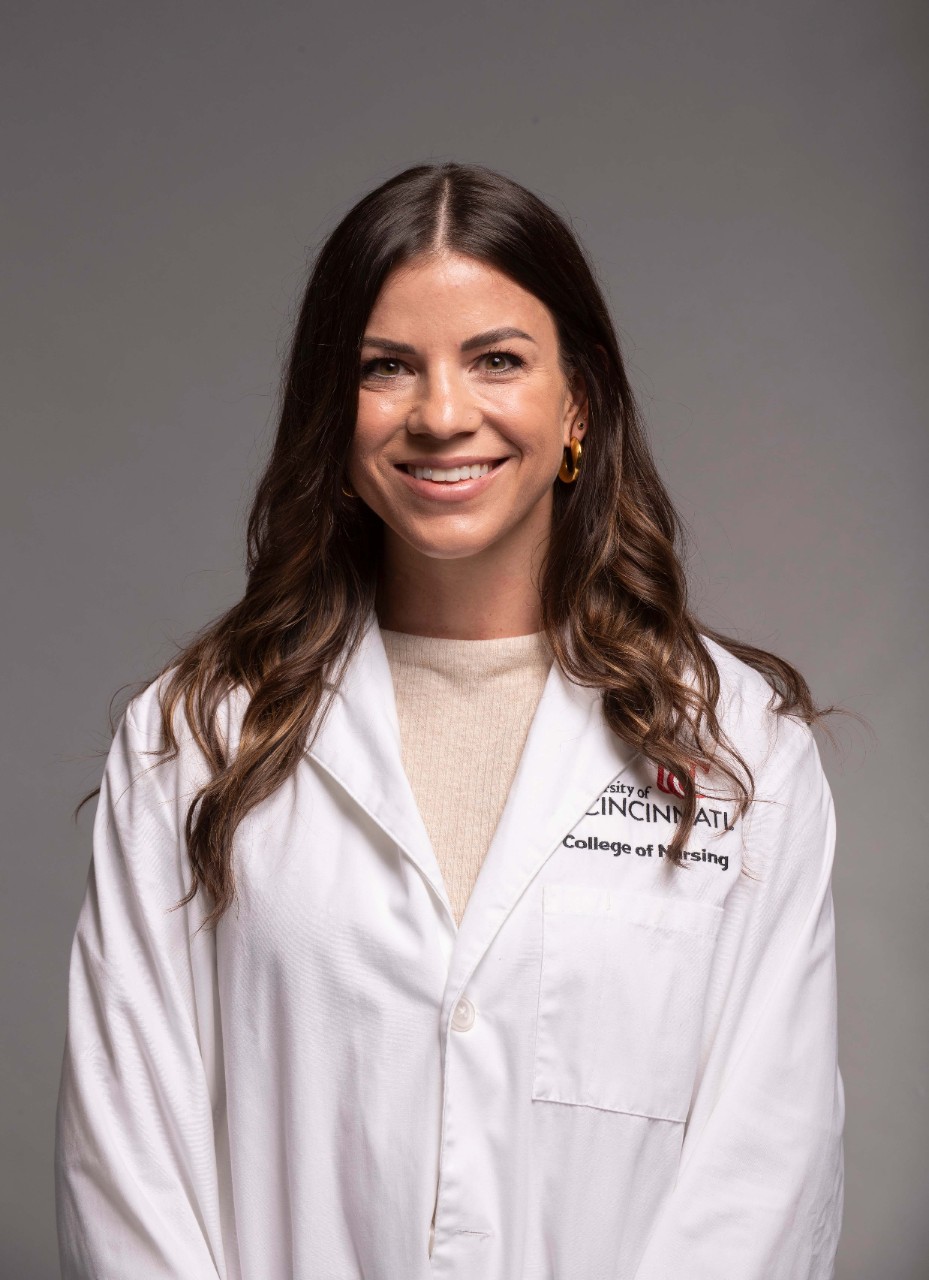 Angela Dobos, a third-year Doctor of Nursing Practice (DNP) student, wearing a white lab coat.