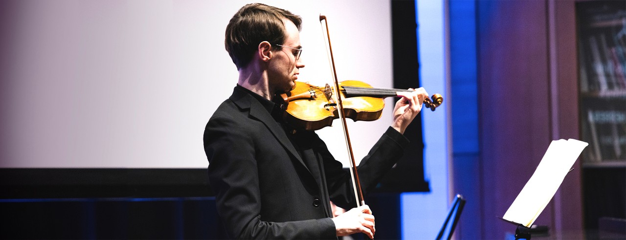 Violinist Kenneth Renshaw performs. 