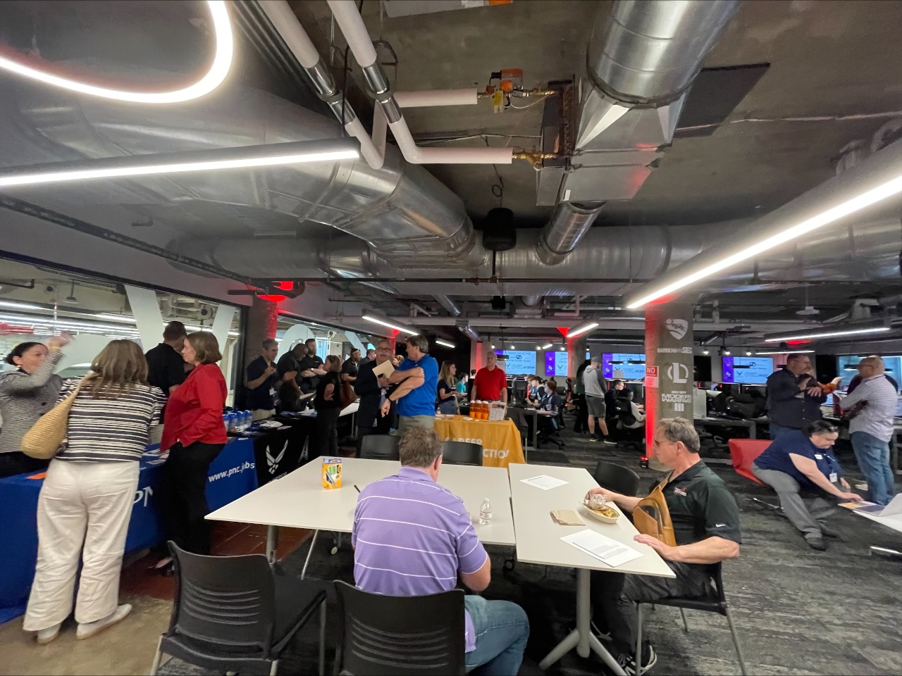 University and high school students pack the inside of the UC Esports Innovation Lab. 