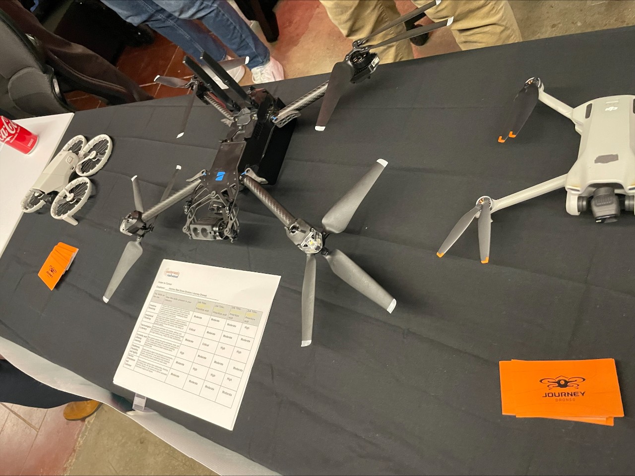 Journey Drones, a potential employer display different drone models at their booth.