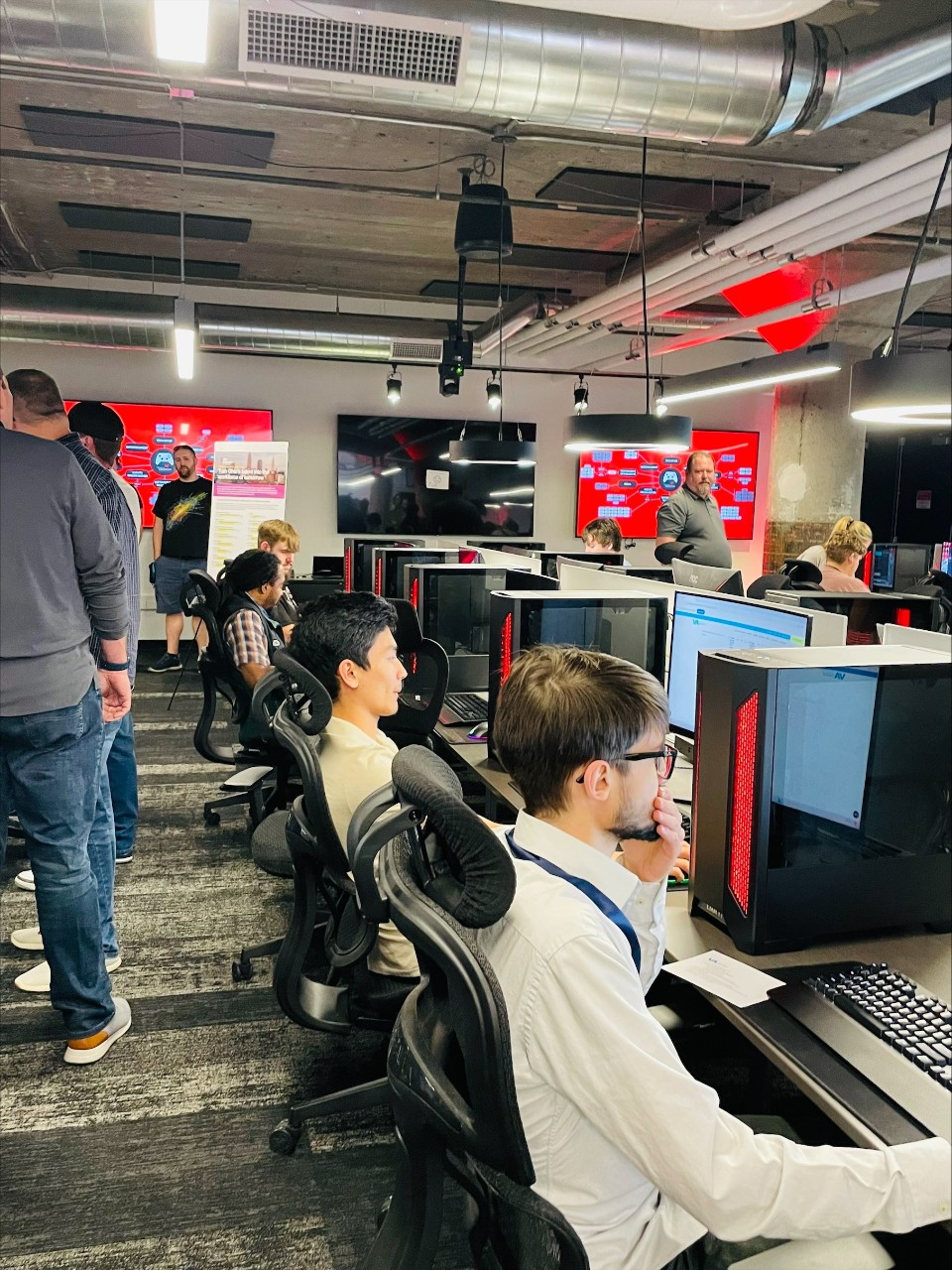 Students sitting at gaming consoles inside the Esports Innovation Lab. 