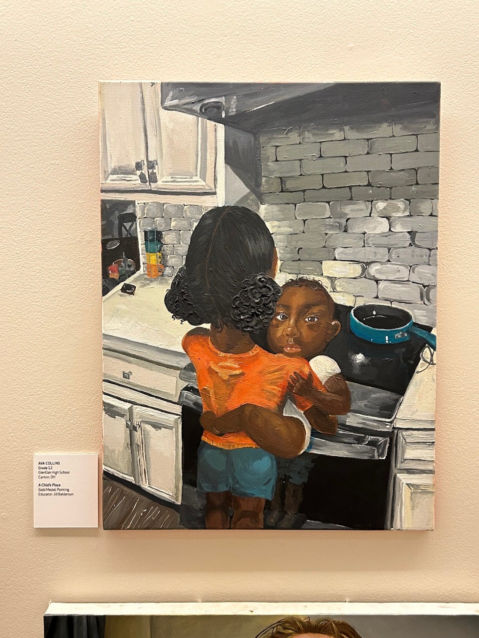 A painting of a woman holding a baby at a stove in a kitchen.