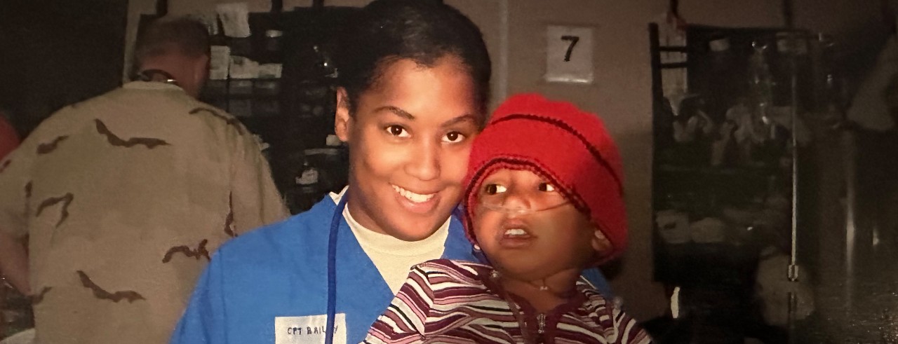 Nikki Smith and a child in the ER in Baghdad, Iraq