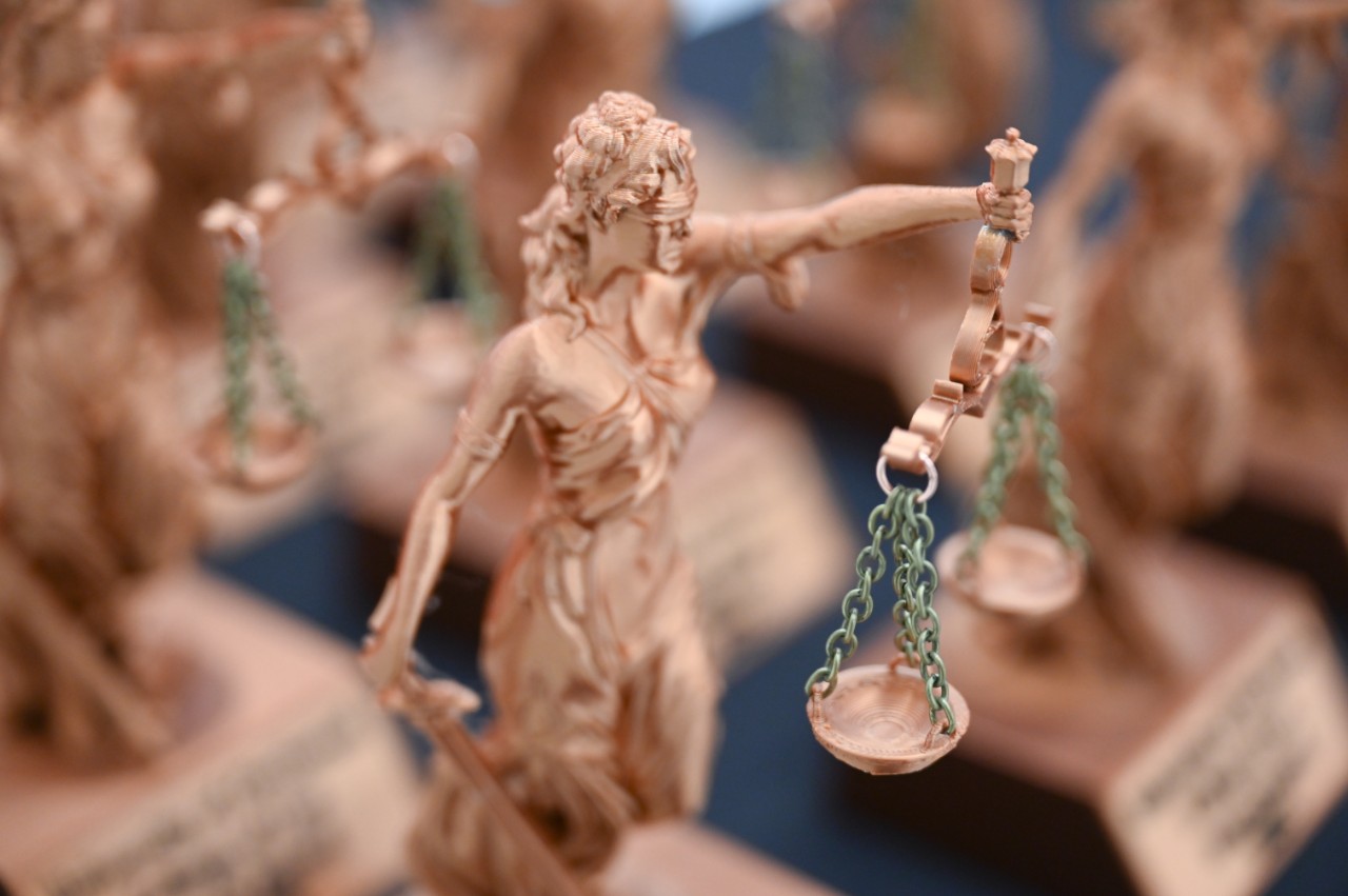 Photos of the Scales of Justice award. Photo/Joey Yerace