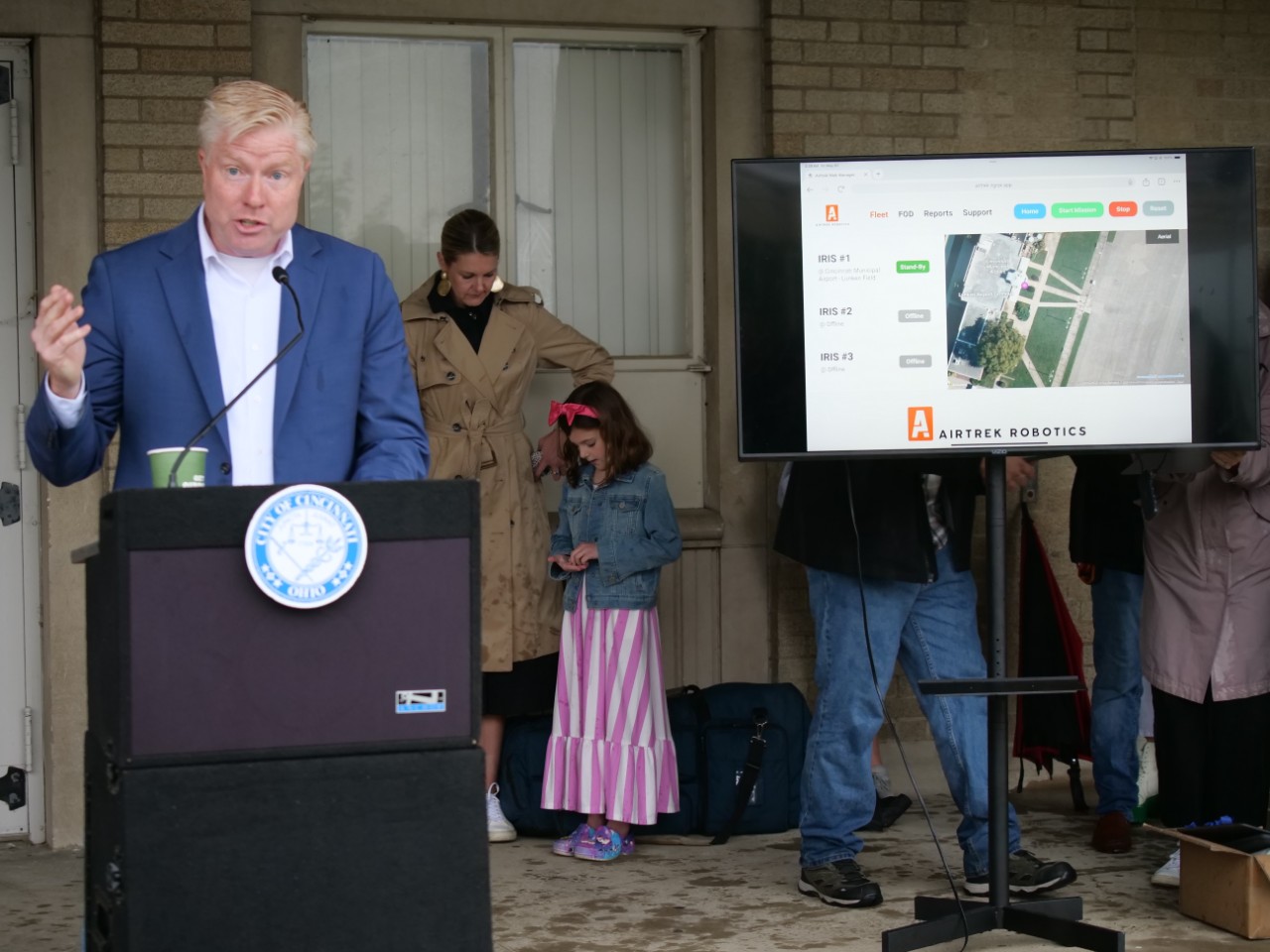 Councilmember Mark Jeffreys stands at podium to welcome guests.
