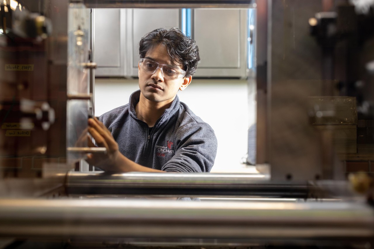 Co-op engineering student overseeing large machinery