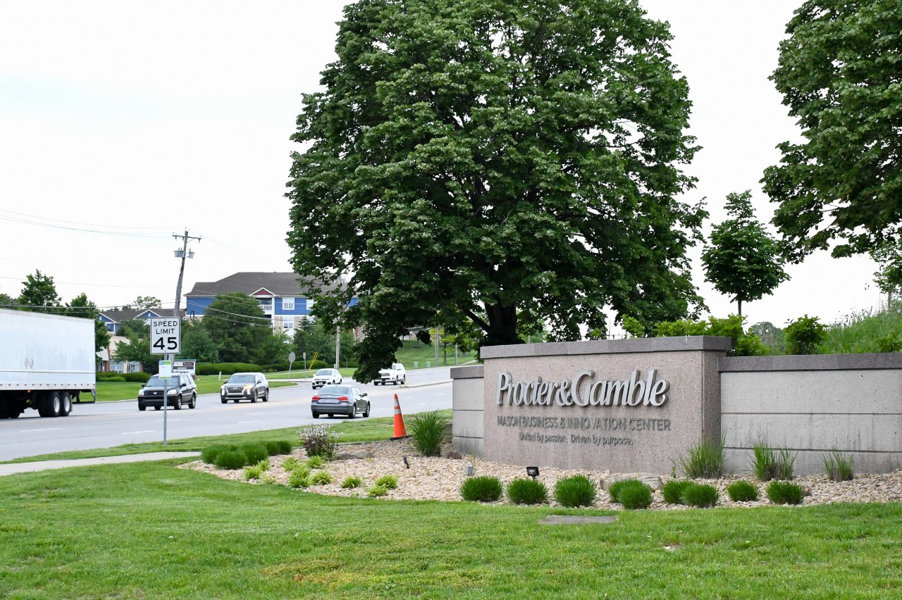 Traffic drives past the entrance to Procter & Gamble's Mason Business and Innovation Center sign.