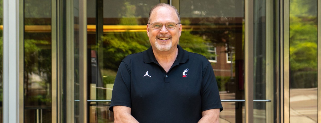 Dave Kelley smiling outside on a sunny day