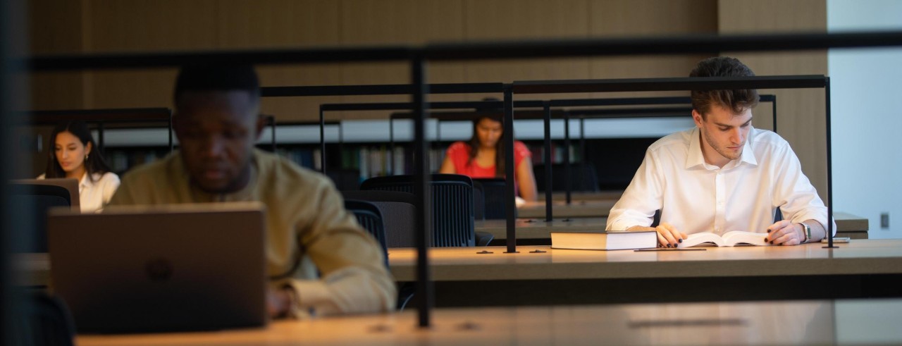 Four law students seen studing in the law library at the University of Cincinnati